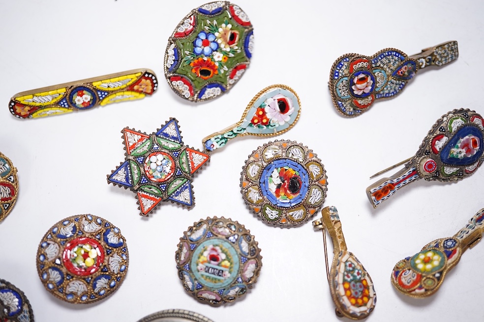 A collection of thirty-one micro-mosaic brooches, including fourteen mixed guitar and banjo shaped brooches, six large oval brooches and seven smaller brooches, three long brooches and a star shaped brooch. Condition - g